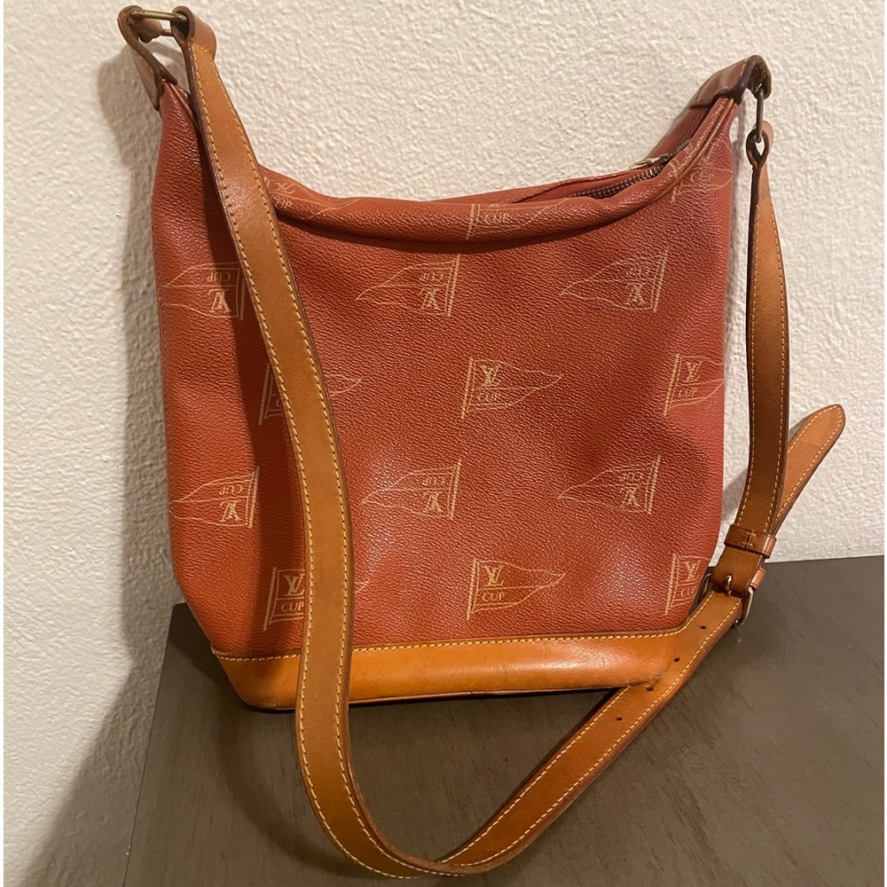Used and selling as is. Louis Vuitton Cup 1995 needs repair